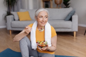 Patient in Austin eating healthy with dental implants