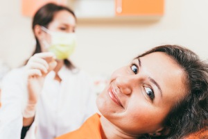 Patient with dental implants in Austin smiling at their dentist